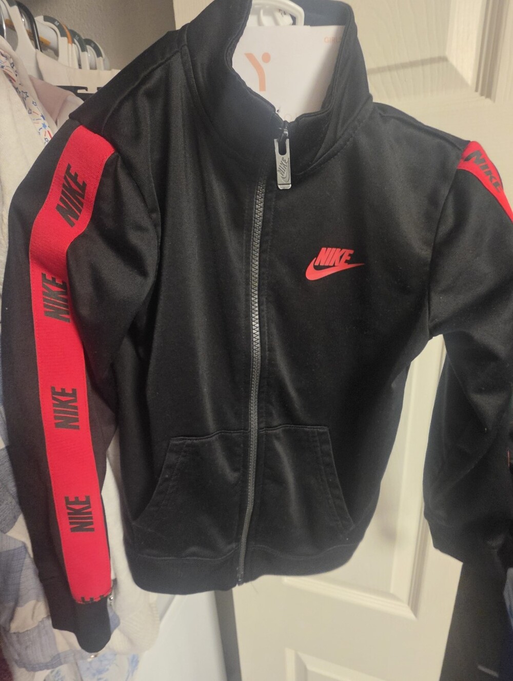 Nike Black Track Jacket with Red Stripe Accent